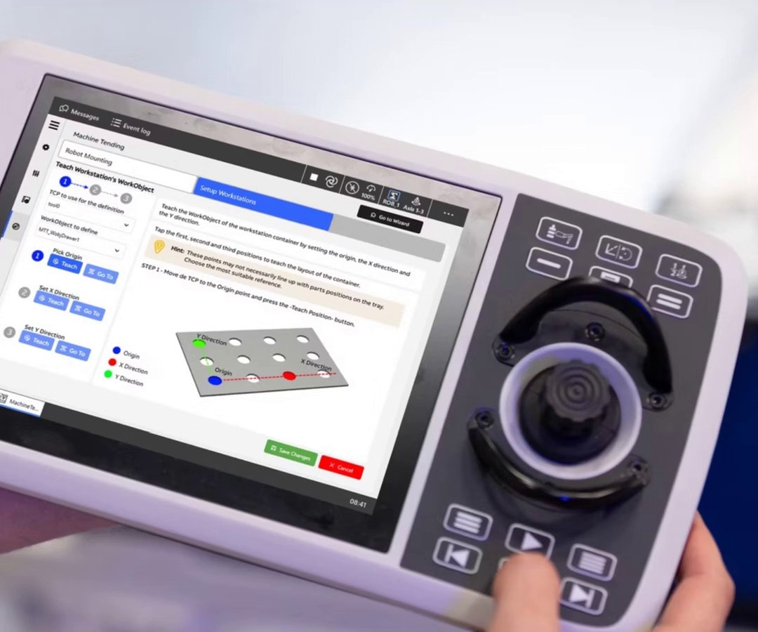 ABB FlexPendant showing the Machine Tending app with a tray of parts on screen